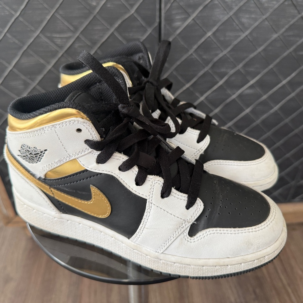 The Air Jordan 1 Mid GS ‘White Gold’ Big Kid Sneaker